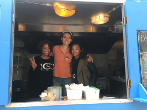 Cat and Jasmine helping out on the truck