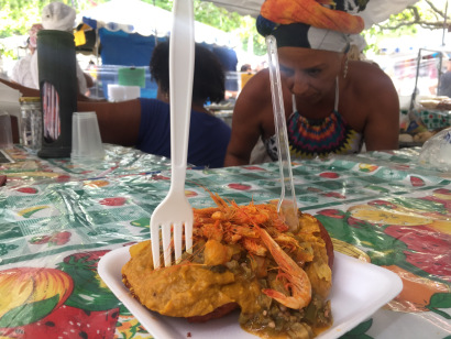 Acarajé is a dish made from peeled beans formed into a ball and then deep-fried in dendê. It's surved with curry paste and okra and dried shrimp and pepper paste. It's from the state of Bahia, but I was able to try in at a market in Rio.